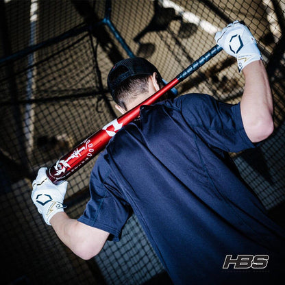 A Baseball Player Flexing with the brand new 2025 Voodoo One BBCOR Bat from Headbanger Sports