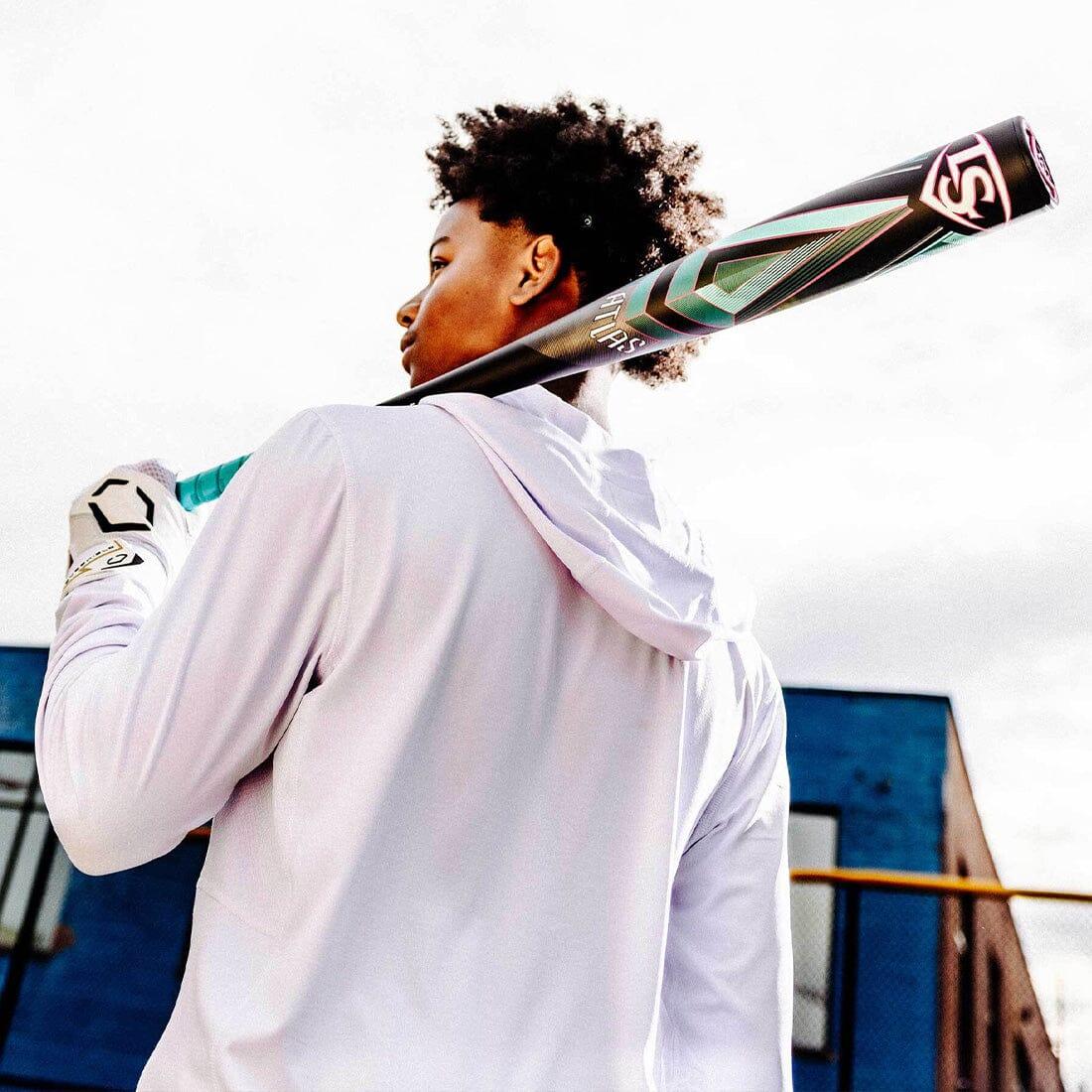 A Baseball Player Holding a 2025 Louisville Slugger ATLAS (-3) BBCOR Baseball Bat from Headbanger Sports