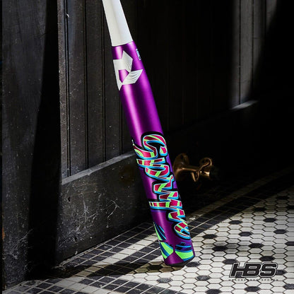 The New 2025 DeMarini SPRYTE (-12) Fastpitch Softball Bat from Headbanger Sports leaned on a door with tile flooring