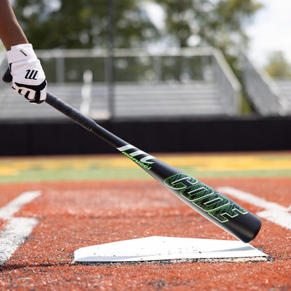 A Baseball Player holding a Marucci Code Baseball Bat on the field