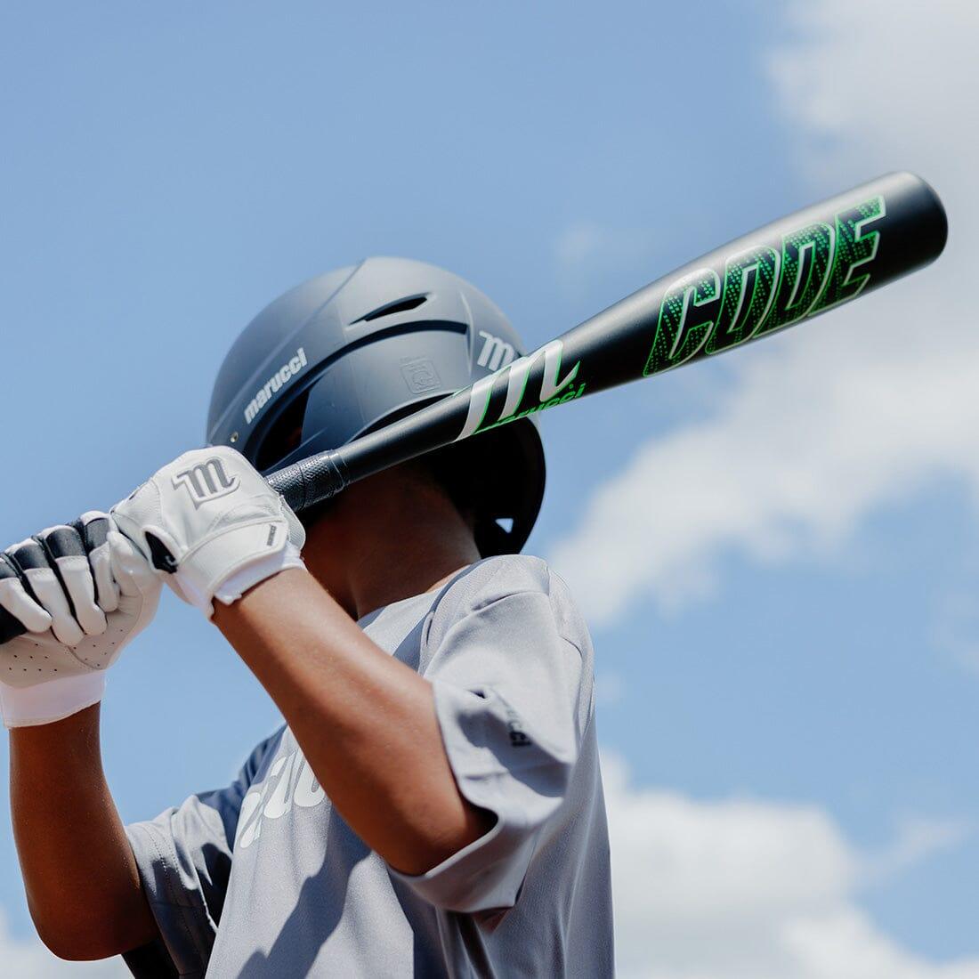 A Baseball player holding a Marucci Code from Headbanger Sports on a sunny day