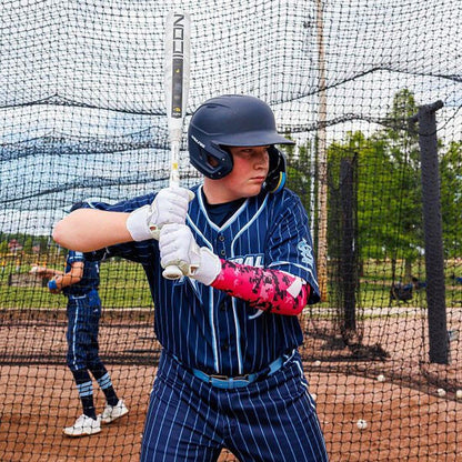 A Baseball Player Hitting in the Cages Before a Game Swinging His Rawlings ICON USSSA Baseball Bat From Headbanger Sports