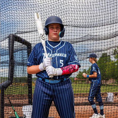 A Baseball Player Posing with his brand new Rawlings Icon USSSA Baseball Bat from Headbanger Sports