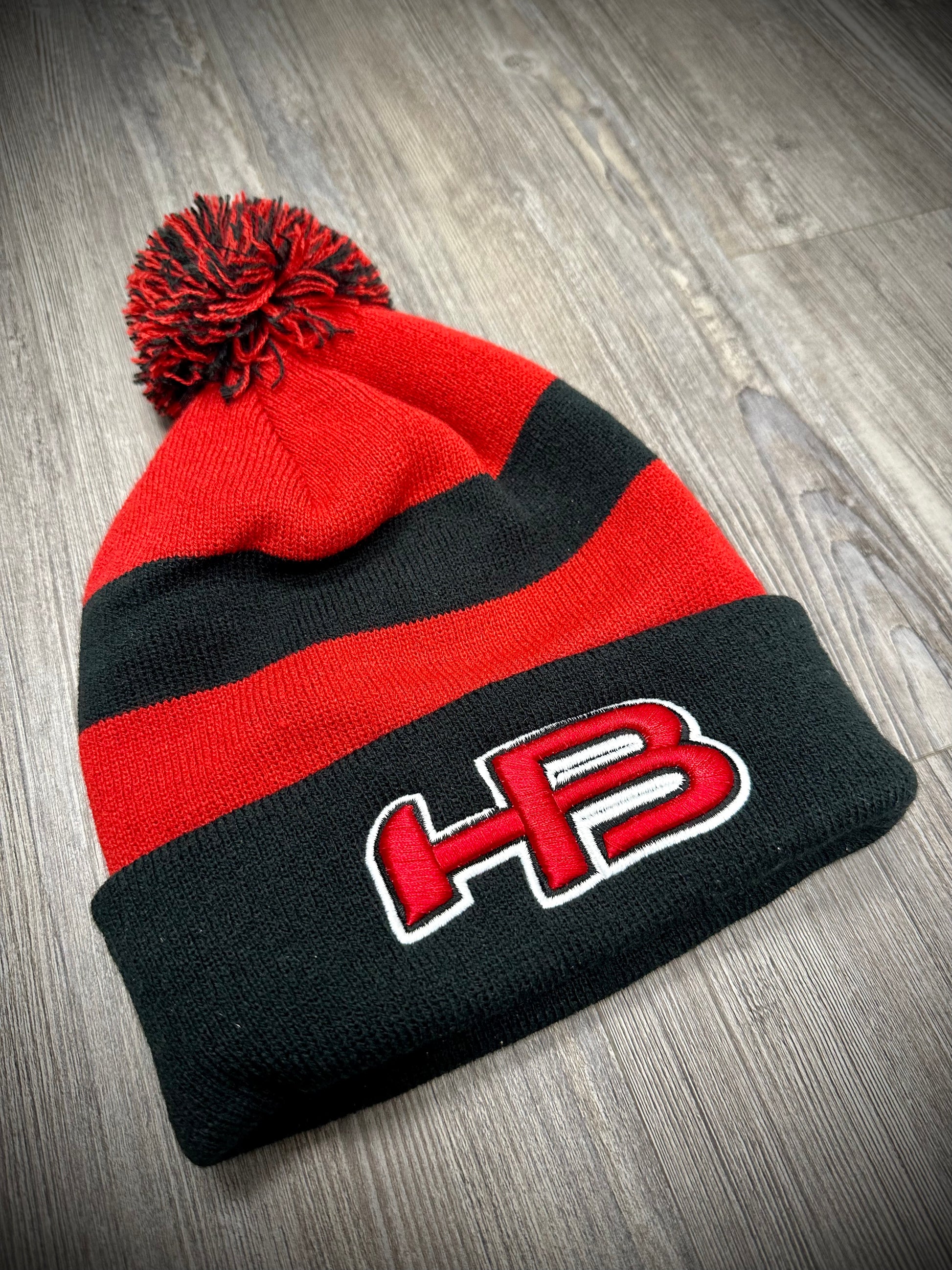 Shop HB Sports Striped Color Winter Pom-Pom Beanie Hat: Black, Red, and Black at Headbanger Sports